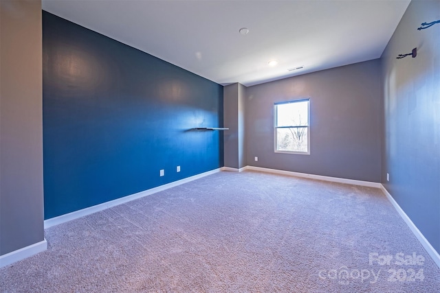 empty room featuring carpet floors