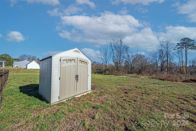 view of outdoor structure with a lawn