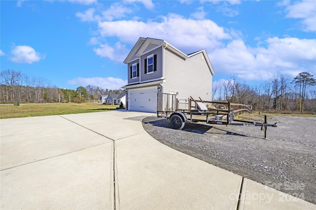 view of home's exterior with a lawn and a garage