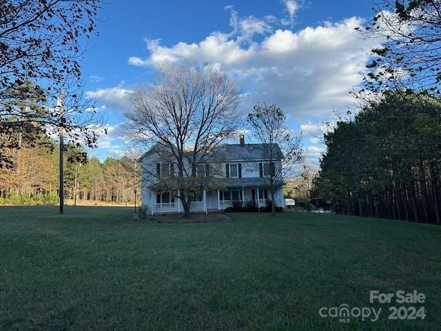 view of front of home with a front yard