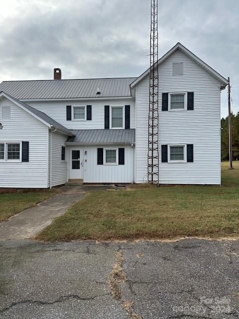 view of front property with a front lawn