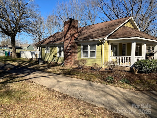 view of front of home featuring covered porch and central AC unit