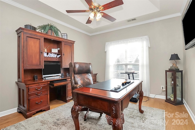 home office with crown molding, light hardwood / wood-style flooring, and ceiling fan