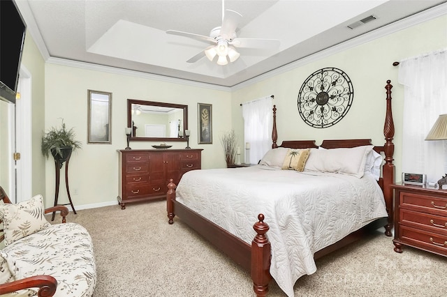 bedroom with light carpet, ceiling fan, and crown molding