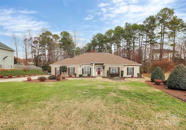 ranch-style house featuring a front lawn