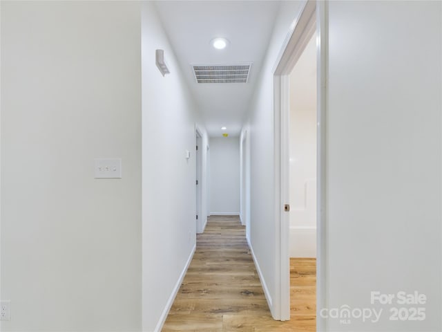 corridor featuring light hardwood / wood-style floors