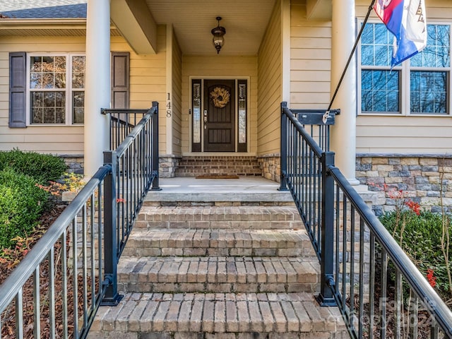 view of exterior entry featuring a porch