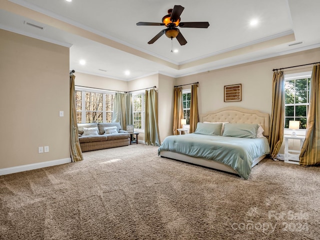 bedroom with carpet, a raised ceiling, ceiling fan, and crown molding