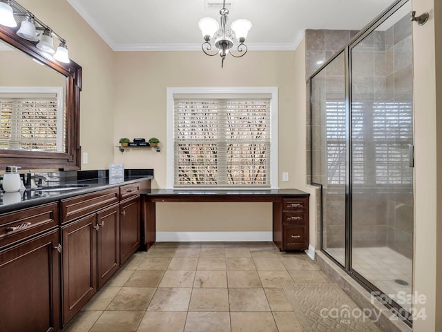 bathroom with vanity, tile patterned flooring, ornamental molding, walk in shower, and a notable chandelier