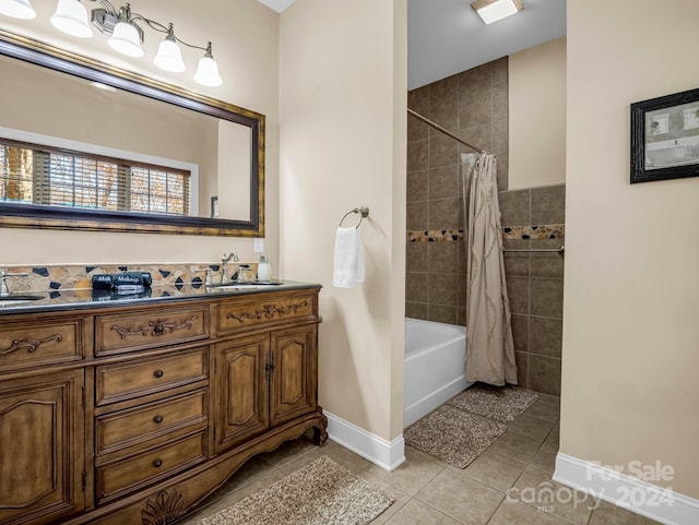 bathroom with tile patterned flooring, vanity, and shower / bath combo