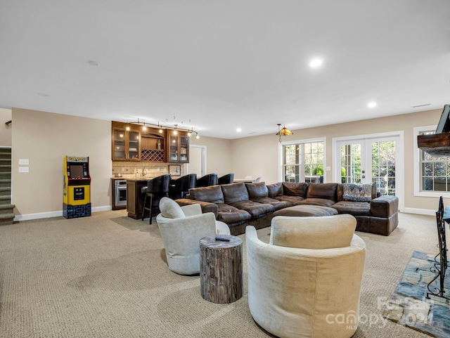 carpeted living room with french doors and indoor bar