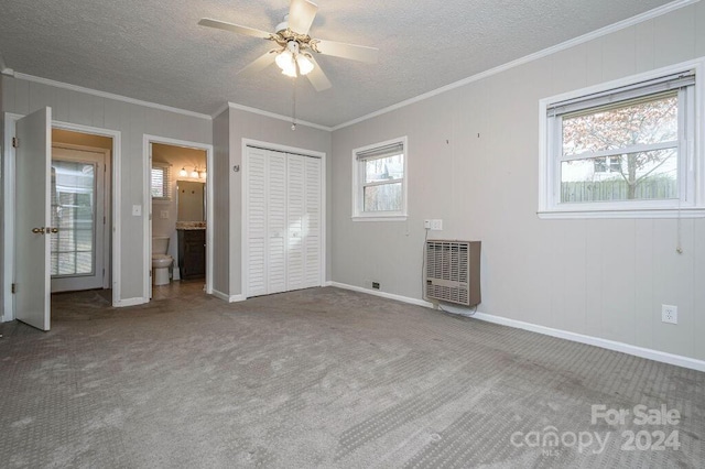 unfurnished bedroom with connected bathroom, ceiling fan, and carpet