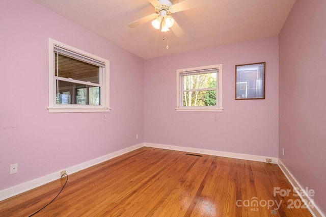 spare room featuring ceiling fan and wood-type flooring