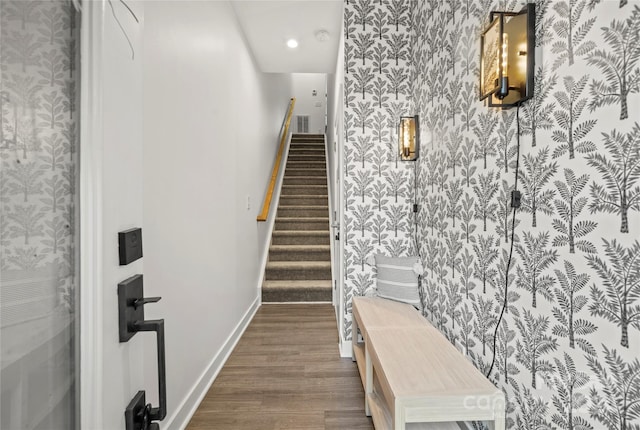 stairway featuring hardwood / wood-style flooring