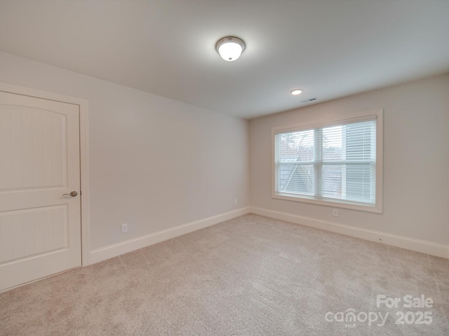 view of carpeted spare room