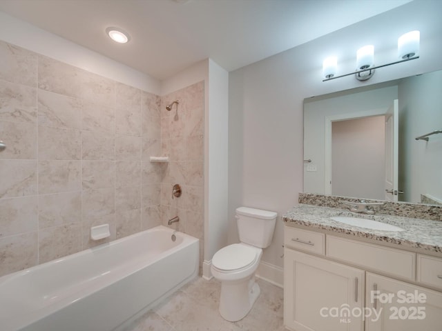 full bathroom featuring vanity, toilet, and tiled shower / bath