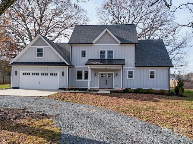 view of front of house featuring covered porch and a garage