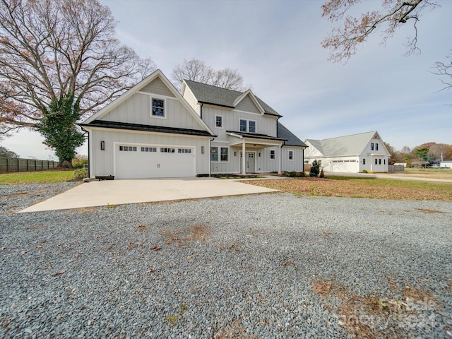 view of front facade with covered porch and a garage