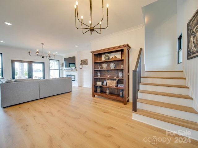 unfurnished living room featuring french doors and light hardwood / wood-style floors