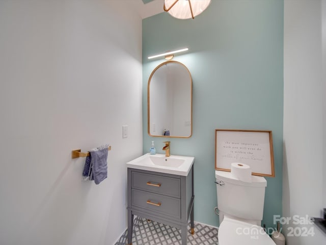 bathroom with vanity and toilet