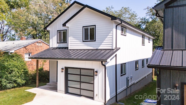 modern farmhouse style home with a garage