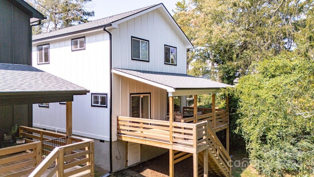 back of house featuring a wooden deck