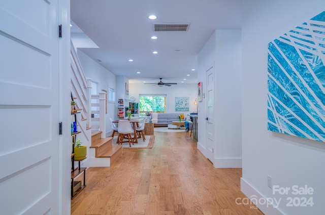 hall with light hardwood / wood-style floors