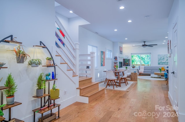 interior space with ceiling fan and light wood-type flooring