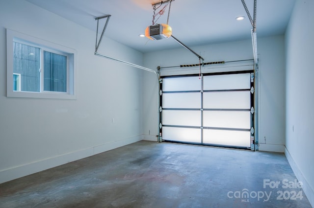 garage featuring a garage door opener