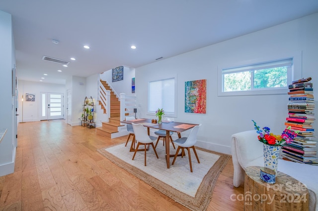 dining area featuring light wood-type flooring