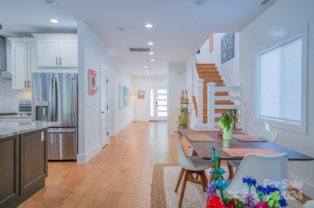 dining area with light wood-type flooring