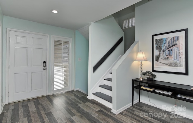 foyer with dark wood-type flooring