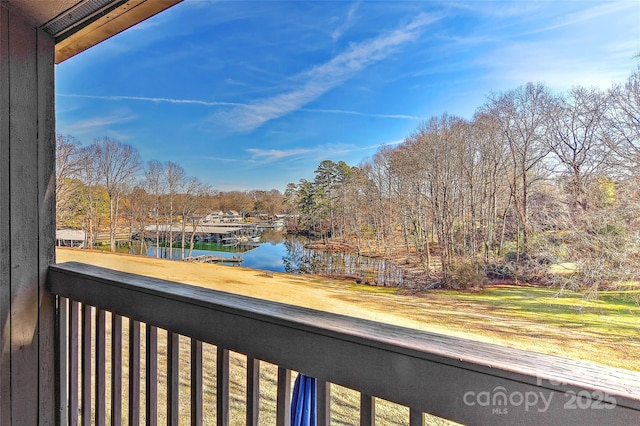 balcony featuring a water view