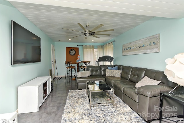 living room with concrete floors and ceiling fan