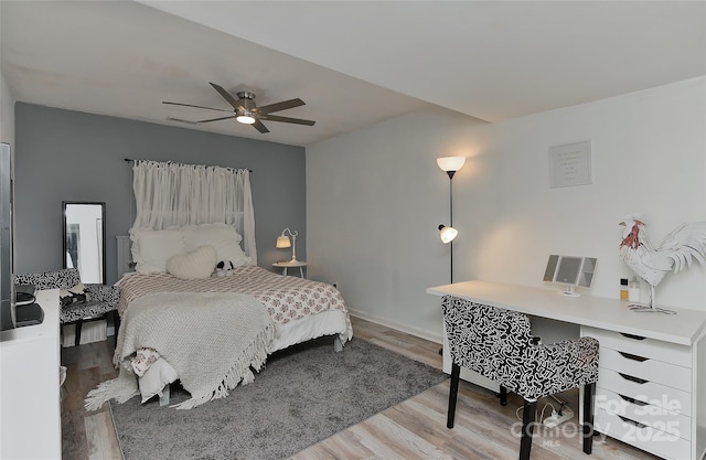 bedroom with ceiling fan and light wood-type flooring