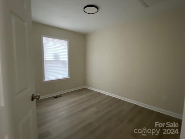 empty room featuring wood-type flooring