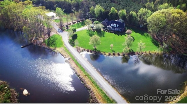 bird's eye view with a water view