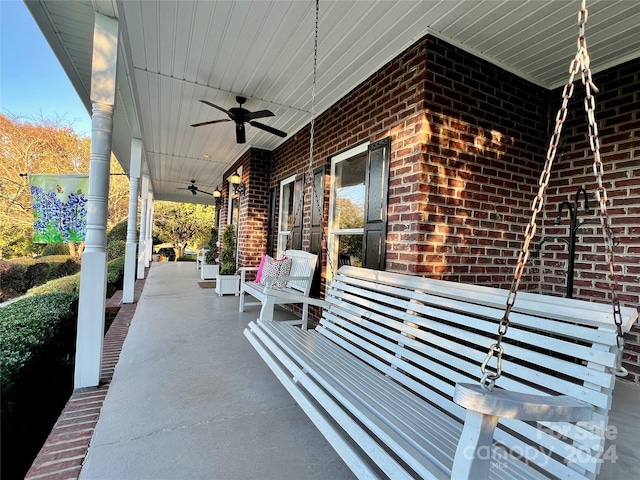 view of patio with ceiling fan and a porch