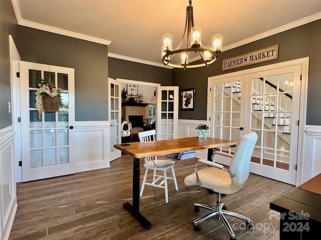 home office with a notable chandelier, dark hardwood / wood-style floors, crown molding, and french doors