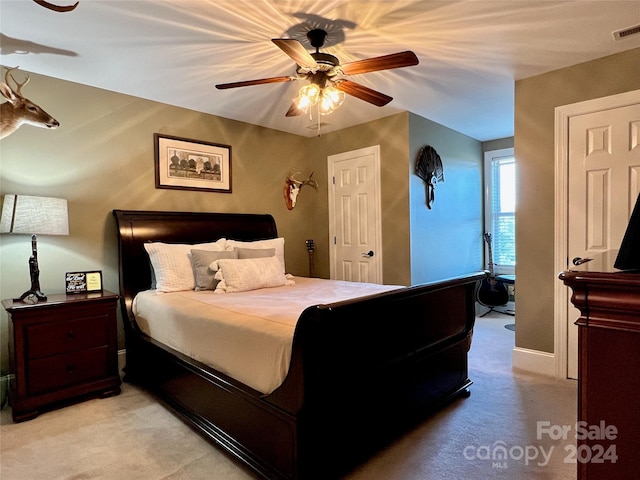 carpeted bedroom with ceiling fan