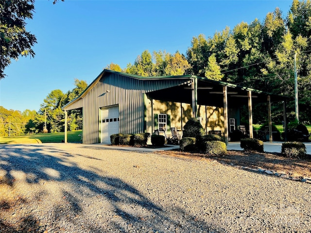 exterior space with an outbuilding and a garage