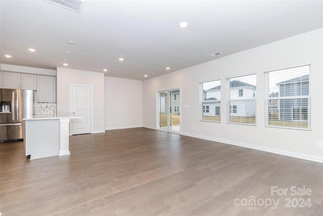 unfurnished living room featuring light wood-type flooring