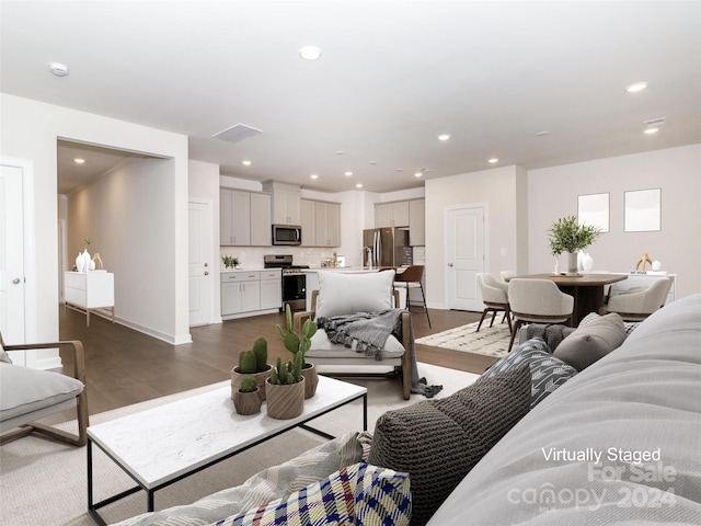 living room featuring dark wood-type flooring