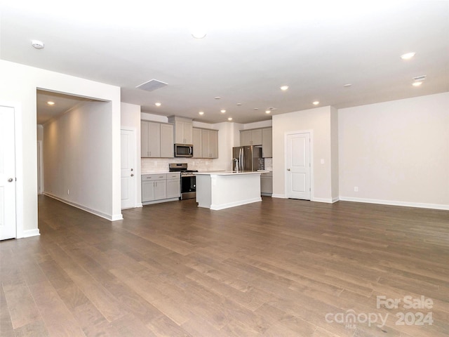 unfurnished living room featuring wood-type flooring