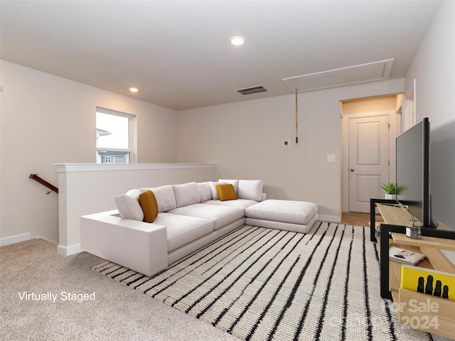 living room with light colored carpet