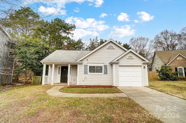 single story home with a garage and a front lawn