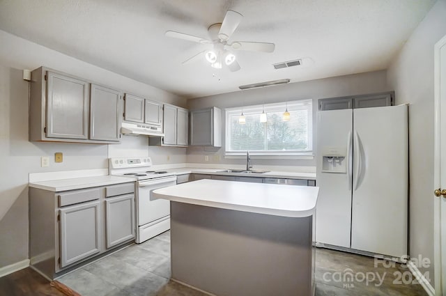 kitchen featuring ceiling fan, sink, white refrigerator with ice dispenser, electric stove, and a kitchen island