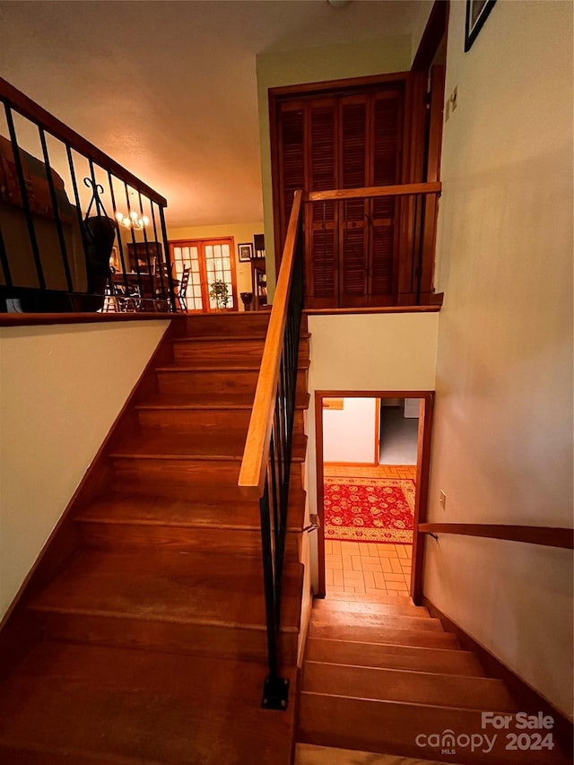 staircase featuring wood-type flooring