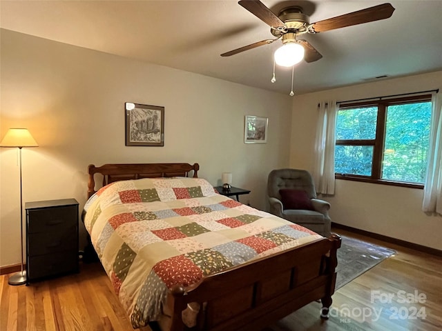 bedroom featuring ceiling fan and hardwood / wood-style flooring