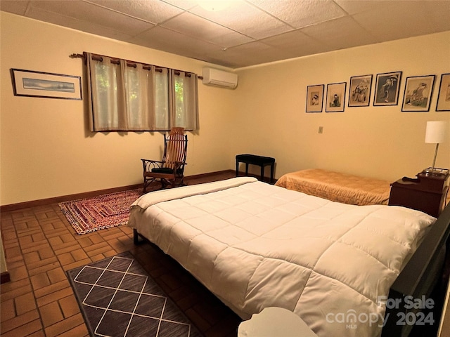 bedroom featuring a wall mounted air conditioner